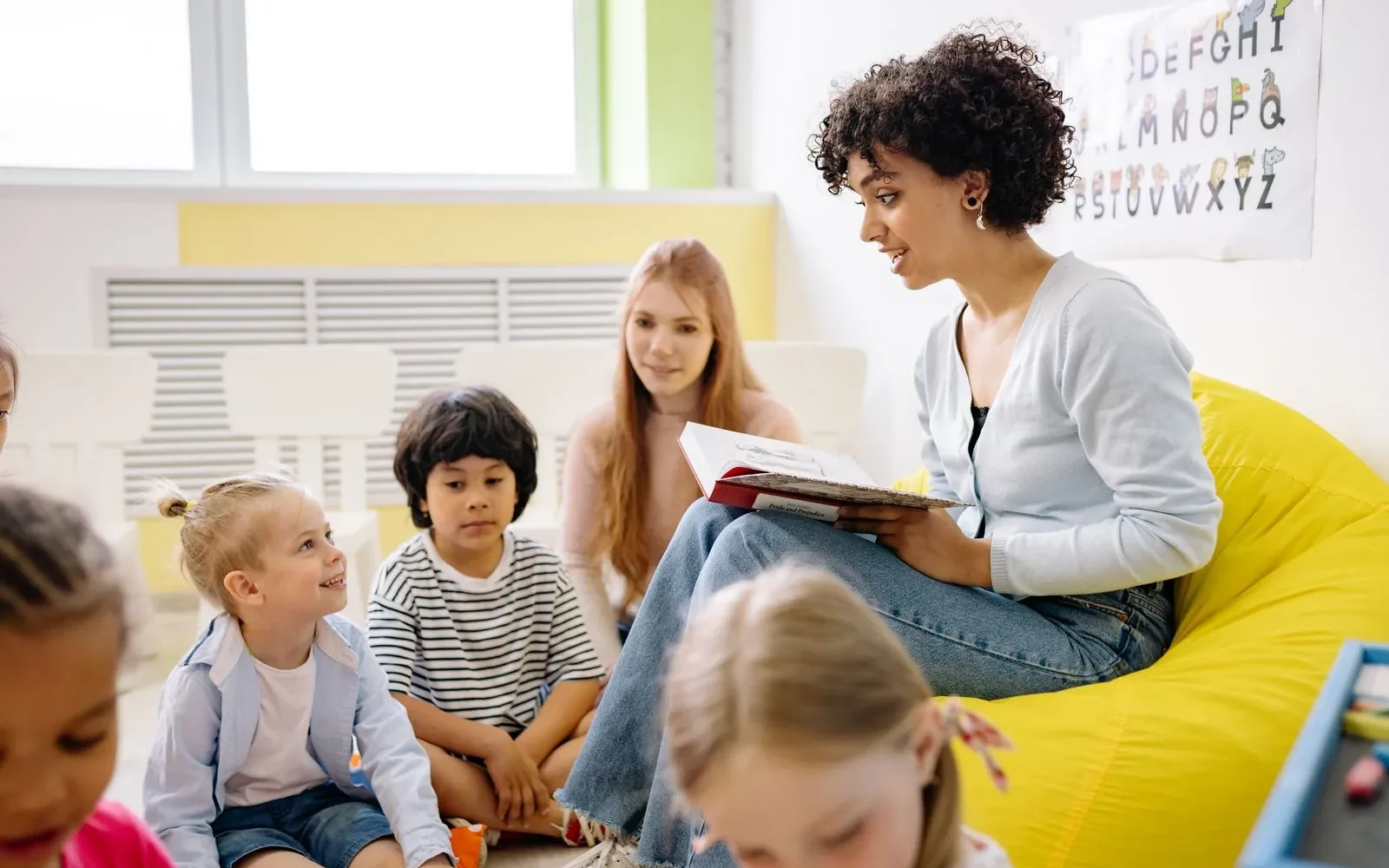 Teacher reading bible story children