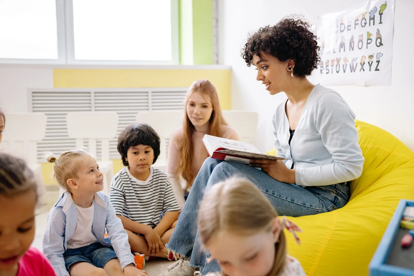 Teacher reading bible story children