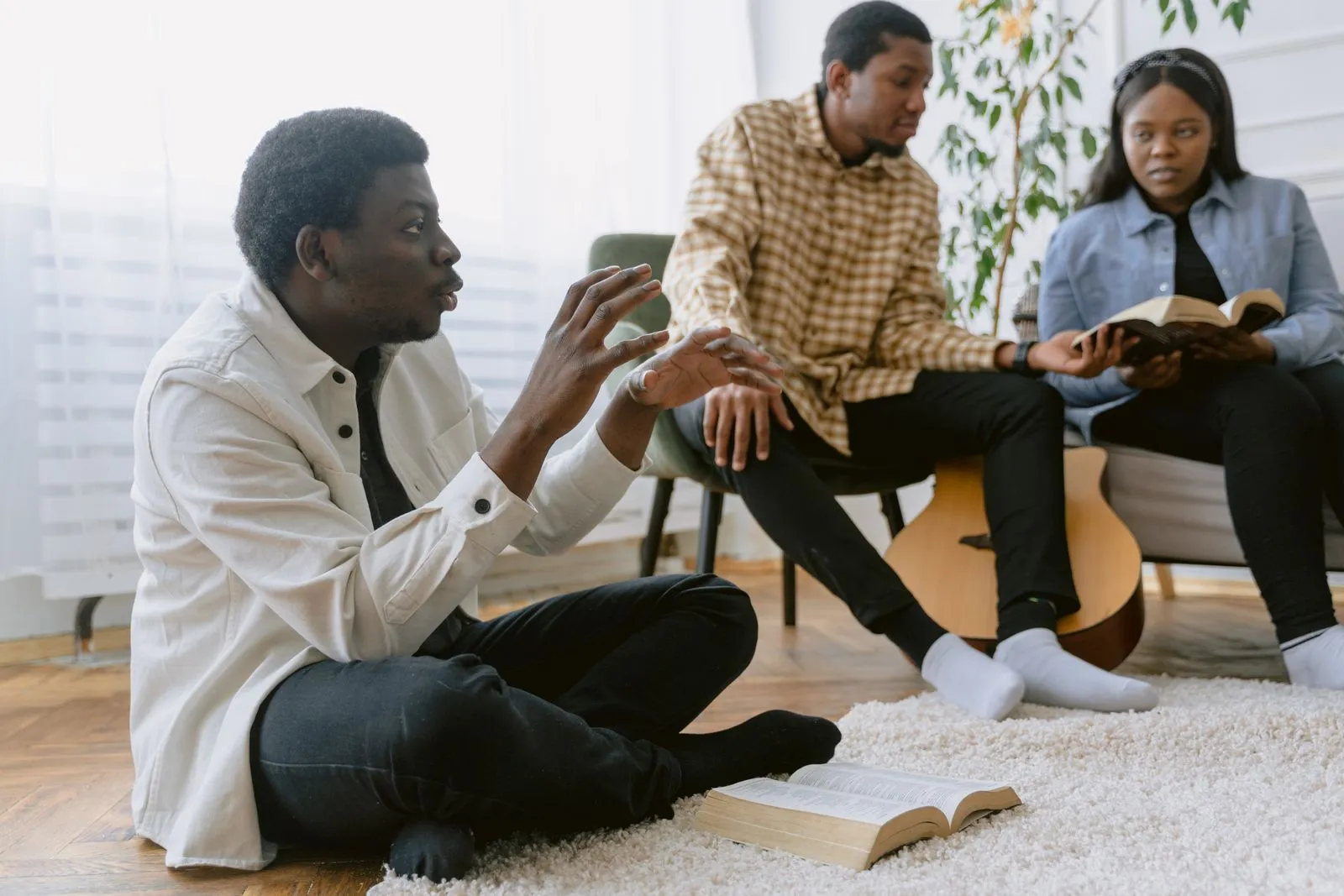 Three men studying bible together
