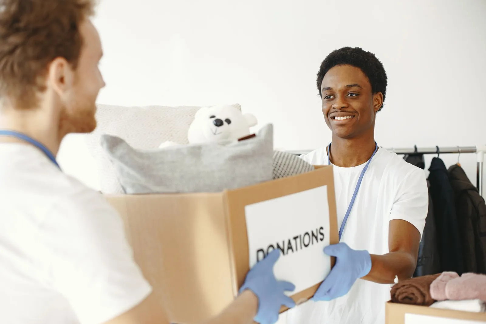 Volunteers handing over boxes donations