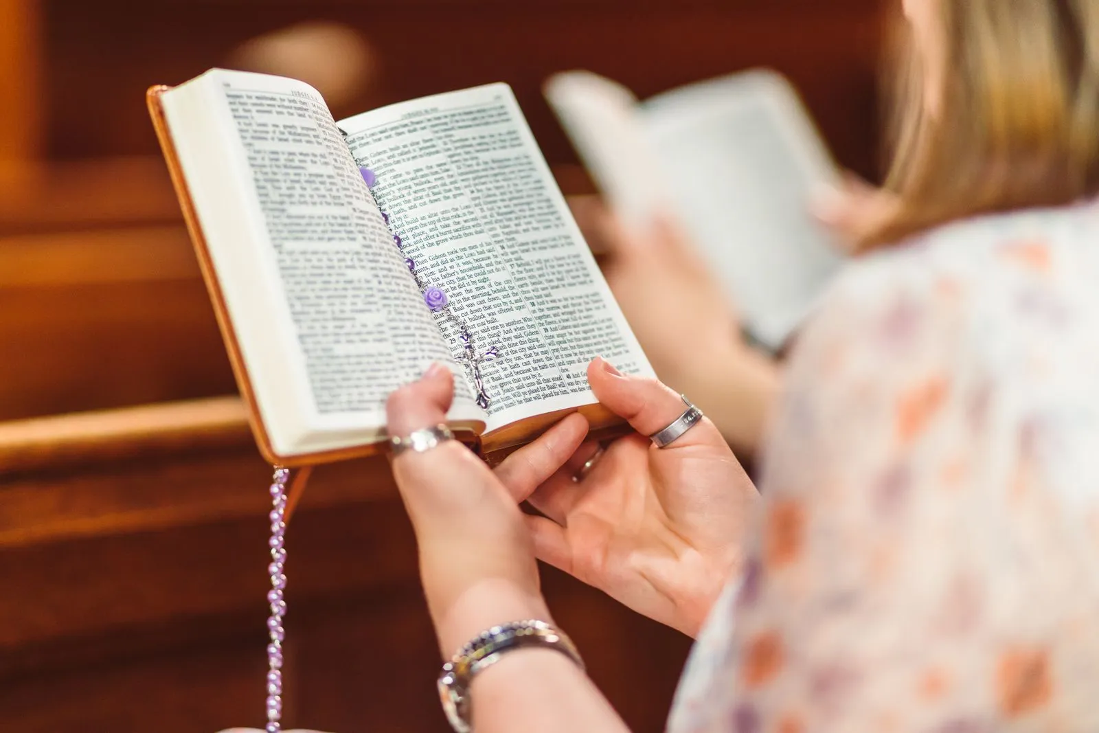 Woman holding open bible